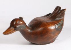 A polychrome duck decoy, circa 1900-30 With large bill, crest feathers and wide body, height 15.5cm,