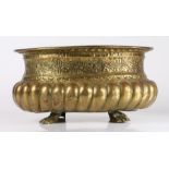 WITHDRAWN A 19th century brass repoussé jardiniere Of oval form, with gadrooned base, below a band