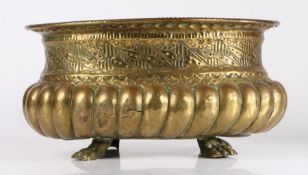 WITHDRAWN A 19th century brass repoussé jardiniere Of oval form, with gadrooned base, below a band