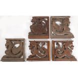 Five 19th century carved oak brackets Each carved as mythical beasts, with chamfered frames, each