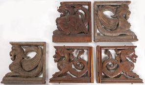 Five 19th century carved oak brackets Each carved as mythical beasts, with chamfered frames, each