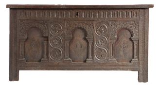 An Elizabeth I oak and inlaid coffer, circa 1580 Having a triple-panelled lid, the front of three