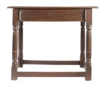 A Charles II oak side table, circa 1680 Having an end-cleated twin-boarded top, a run-moulded drawer