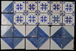 A collection of 18th century Delft tiles Including ten with central flower heads, together with a