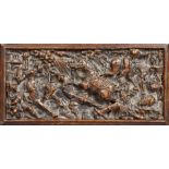 A mid-16th century carved walnut narrative panel, French, circa 1540-60 Designed with a battle scene