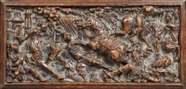 A mid-16th century carved walnut narrative panel, French, circa 1540-60 Designed with a battle scene