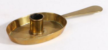 A small 18th century brass chamberstick, English, circa 1720-40 Having an oval pan, with tapering
