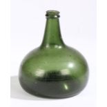 An early 18th century glass onion bottle, English, 1700-1720 Green glass, inverted pontil mark to