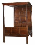 A William & Mary and later oak tester bed, Cumbria, dated 1699 Having an eighteen-panelled tester,