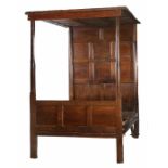 A William & Mary and later oak tester bed, Cumbria, dated 1699 Having an eighteen-panelled tester,