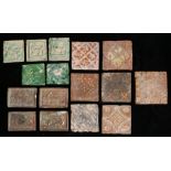 A collection of tiles To include slipware examples, green glazed examples with animals and a brown