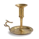 An unusual George III brass chamberstick, circa 1770 Having a tall socket with large flared rim