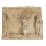 A 17th century carved stone depiction of the Crucifixion The central cross and body of Christ