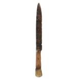 A mid-15th century table knife, circa 1450 The fullered iron blade with a wooden handle, and