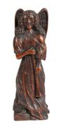 A 17th century carved oak figure of the Archangel Gabriel The winged figure in robes holding a