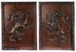 A pair of early 19th century carved ‘limewood’ and oak framed lion rampant panels  One sinister, the