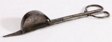A 17th century iron candle-snuffer, English, circa 1680-1700 Of scissor form, one blade with a