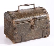 A small oak dug-out casket, probably 16th/17th century Having a one-piece dome lid with iron bale-