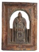 A 19th century carved icon, of a Greek Orthodox Saint With crutches, traces remain of the blue and