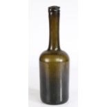 An unusual early 19th century bottle, circa 1800 The ring top above a long neck and cylindrical