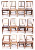 Twelve George III elm dining chairs, East Anglian, circa 1800 Including two armchairs, each with