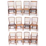 Twelve George III elm dining chairs, East Anglian, circa 1800 Including two armchairs, each with