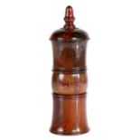 A George III lignum vitae coffee grinder, circa 1760 The finial top above a dome and shaped tower