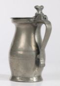 A pewter half-pint bud baluster measure, English, circa 1720 The lid and body with two pairs off