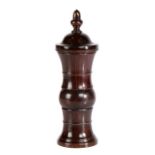 A George III lignum vitae coffee grinder, circa 1770 The finial top above a dome and shaped tower