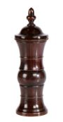 A George III lignum vitae coffee grinder, circa 1770 The finial top above a dome and shaped tower