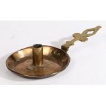 A brass and copper chamberstick, English, circa 1700 The circular copper pan with flared and