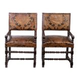 A pair of mid-17th century walnut framed and leather upholstered open armchairs, Flemish Each with a