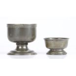 Two late 18th -early 19th century pewter cup salts, probably English The larger with moulded rim and