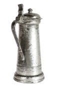 A good James I pewter flagon, circa 1610-20 The tapering drum with single narrow fillet below collar