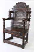 An extraordinary James I joined oak double panel-back open armchair, probably Welsh, dated 1624