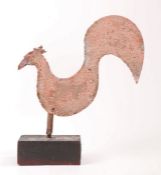 An early 20th century sheet iron cockerel weathervane With curved body, prominent tail 'feather' and