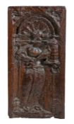 A mid-16th century carved oak panel of St. Barbara, French, circa 1550 The female saint standing