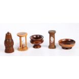 A collection of treen To include two sand glasses, a coquilla pepperette and two lignum-vitae salts,