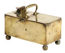 A Victorian brass tobacco-dispensing ‘honour’ box, circa 1850 Of oblong form, with central handle,