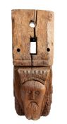 An interesting carved oak beam end/corbel, circa 1500 Carved with the elongated face of a bearded