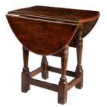 An early 17th century oak joint stool-table, with an early 18th century elm top, English The elm