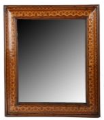 A 19th century walnut and marquetry-inlaid cushion-moulded mirror The rectangular plate within a