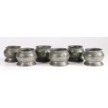 A rare set of six early 19th century pewter bulbous salts, English, circa 1830 Each with a beaded