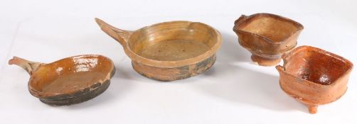 17th century Dutch pottery cooking wares To include two skillets, a tripod pot and a loop handled
