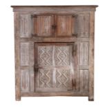 A 16th century style oak livery cupboard, circa 1900 In the Wardour Street manner, English, with