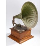 A gramophone, with green painted tin horn