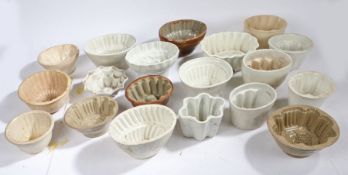 Collection of mostly Victorian stoneware and pottery jelly moulds, various shapes and sizes (22)