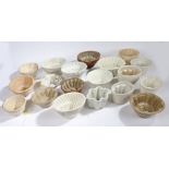 Collection of mostly Victorian stoneware and pottery jelly moulds, various shapes and sizes (22)