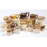 A collection of 19th Century pottery mugs, various designs with treacle glaze rims, to include