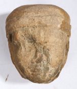 A medieval sandstone carved head, 16th Century, the head of a female wearing a wimple, 15.5cm high